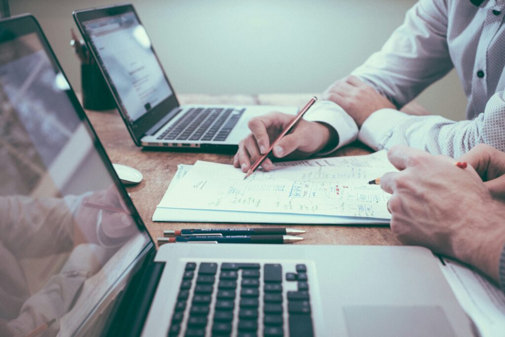 A person reviewing business notes and documents.